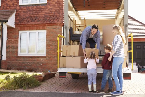Professional team handling furniture pick-up in Croydon storage facility