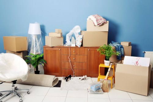 Professional movers handling office furniture during a move in Croydon storage facilities
